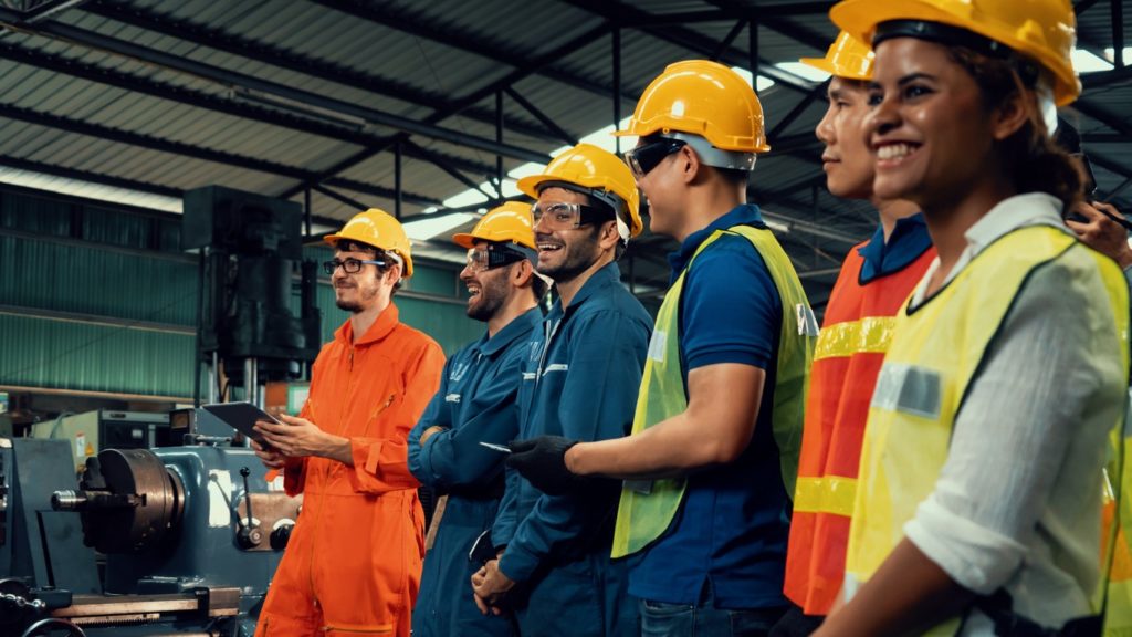 Image of Skillful worker attending brief meeting in the factory .